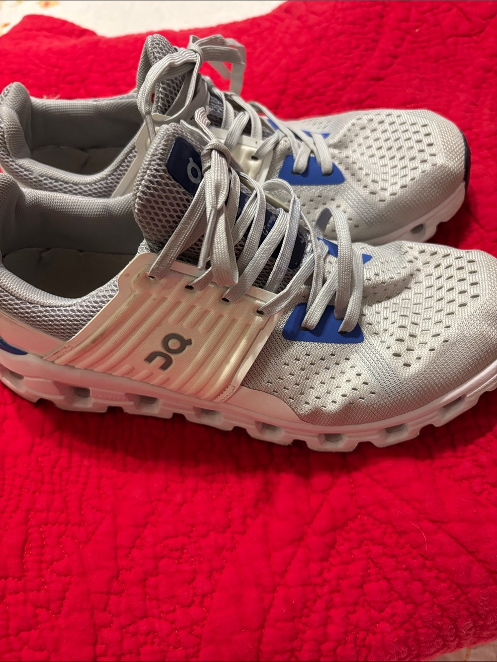 On Running Cloud Shoes in Light Gray with Blue Accents